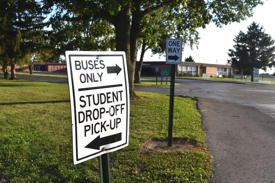 Signs, like these seen here, are posted around the parking lot of both Blissfield Elementary and Blissfield High schools. The signs direct motorists and buses where to go during student dropoff and pickup times. A bond proposal Blissfield Community Schools is putting before its voters Aug. 2, would redesign the dropoff and pickup areas, which would create a separation of parents, buses and pedestrians.