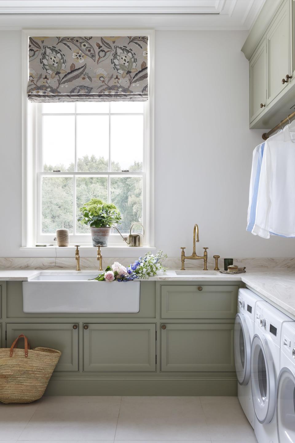 Gray laundry room with built ins