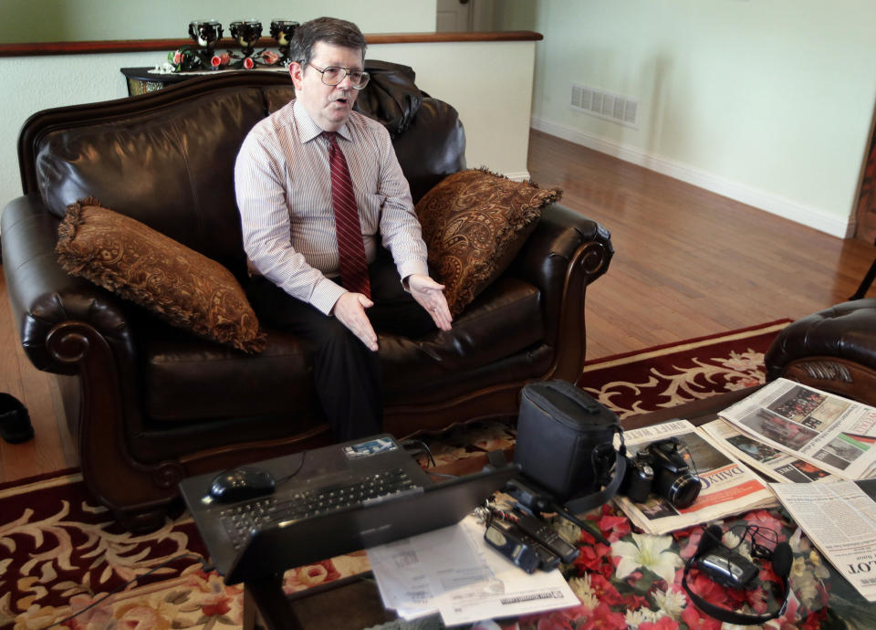 In this Feb. 20, 2019 photo, Facebook blogger Darrell Todd Maurina speaks during an interview at his house in Waynesville, Mo. Maurina says journalists need to go back to the basics to survive, or revive, in small-town America. (AP Photo/Orlin Wagner)