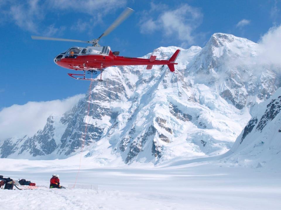 Air ambulance picking up a mountain ranger in Denali National Park.