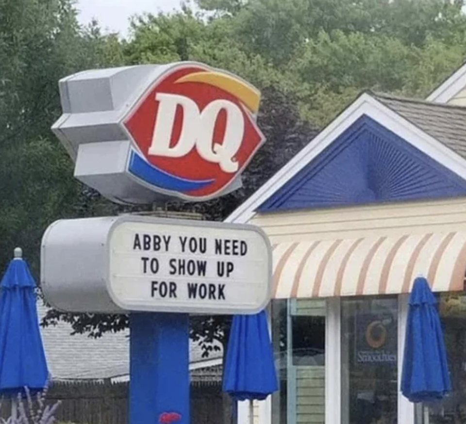 Sign outside Dairy Queen with message "ABBY YOU NEED TO SHOW UP FOR WORK"