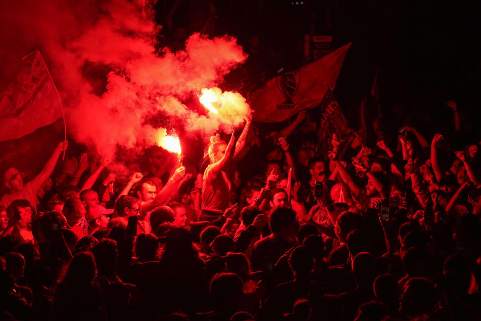 Hundreds of Liverpool fans would not be deterred from celebrating their title win outside Anfield after their 30 year wait.