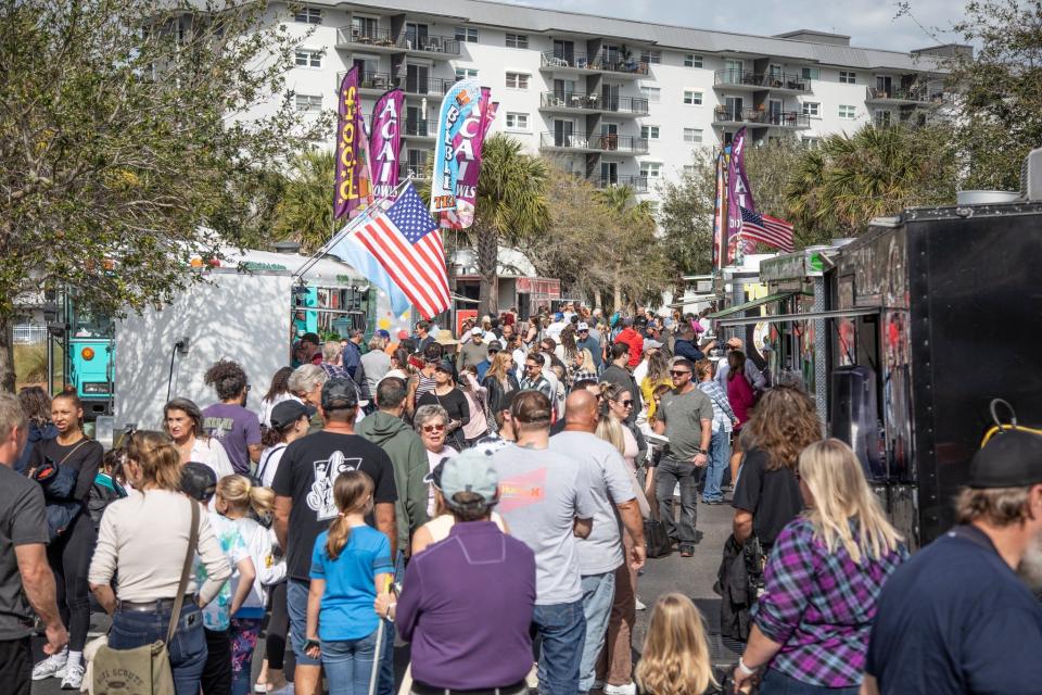 Guests enjoy the 47th edition of "Images: A Festival of the Arts" in New Smyrna Beach in 2023. The popular event returns this weekend, welcoming more than 200 artists from across the United States and Canada.