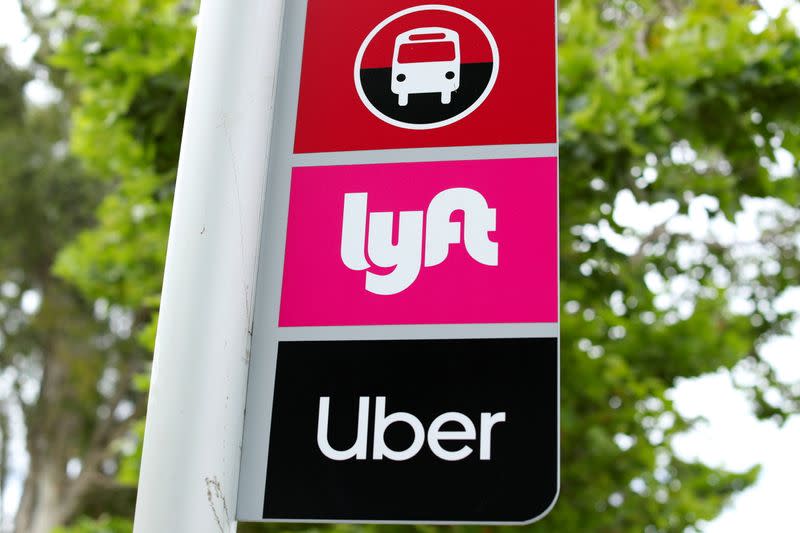 FILE PHOTO: A sign marks a rendezvous location for Lyft and Uber users at San Diego State University in San Diego