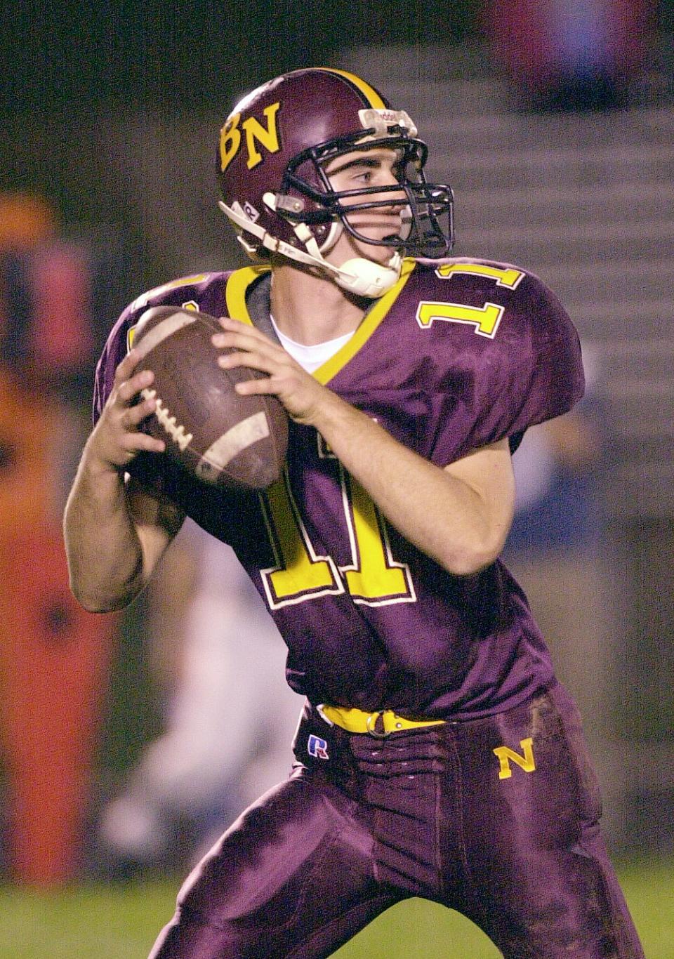 Bloomington North quarterback Anthony Lindsey looks for the open man against Columbus North in their game on Oct. 17, 2001.