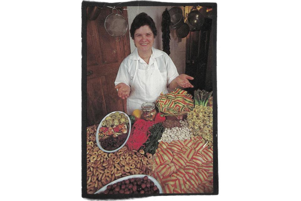 An archival image of Nonna Dora making pasta