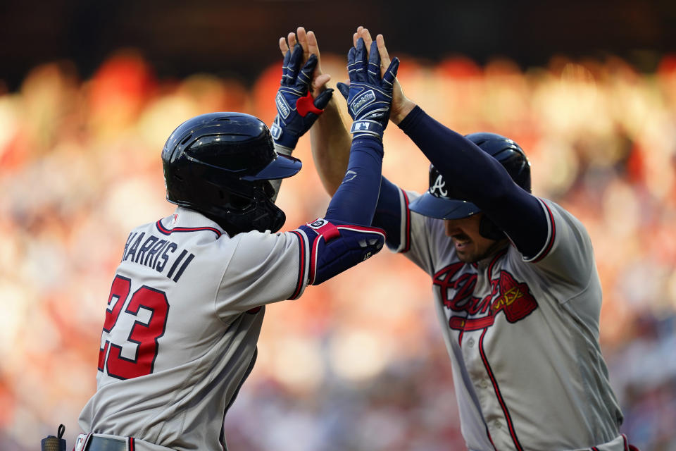 Atlanta Braves' Michael Harris II, left, and Adam Duvall celebrate after Harris' two-run home run against Philadelphia Phillies pitcher Aaron Nola during the fifth inning of a baseball game, Thursday, June 30, 2022, in Philadelphia. (AP Photo/Matt Slocum)