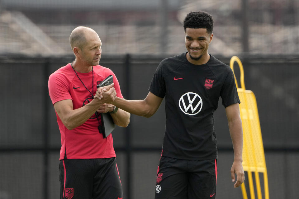 United States men's national soccer team head coach Gregg Berhalter, left, talks with midfielder Malik Tillman during practice Monday, Sept. 4, 2023, in St. Louis. The U.S. is set to play a friendly against Uzbekistan this Saturday in St. Louis. (AP Photo/Jeff Roberson)