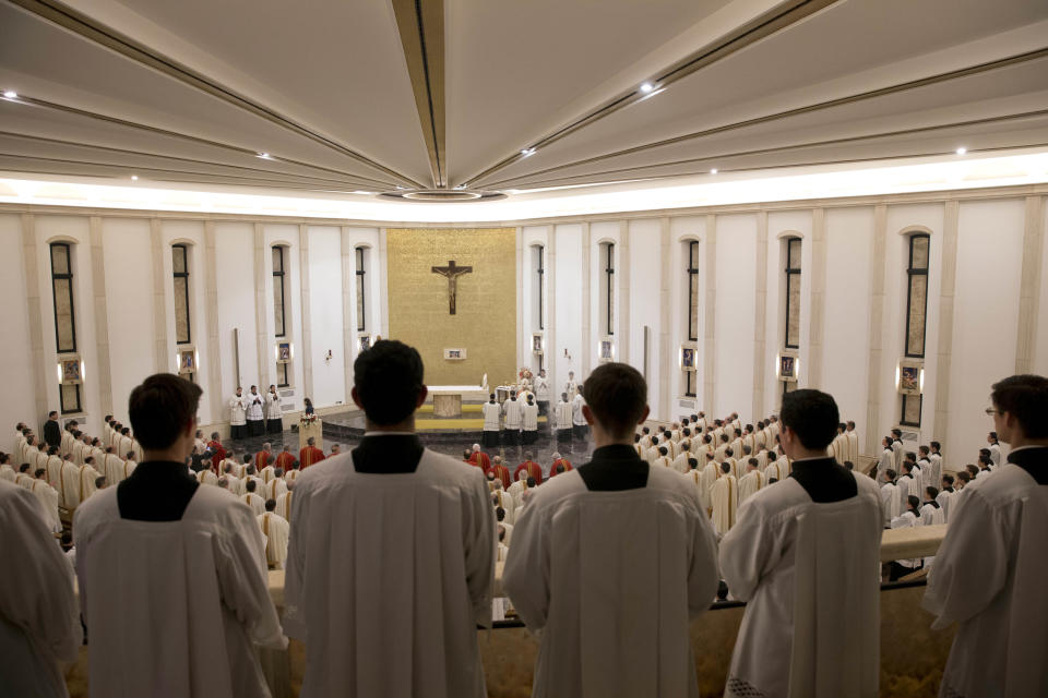 Prelates attend a mass celebrated by Cardinal Velasio De Paolis at the Legion's main headquarters, the Ateneo Pontificio Regina Apostolorum, in Rome, Wednesday, Jan. 8, 2014. The mass marks the opening of the Legion of Christís General Chapter, the month-long meeting where theyíre going to approve new constitutions and elect a new leadership, thus ending a Vatican's three-year reform experiment. (AP Photo/Andrew Medichini)