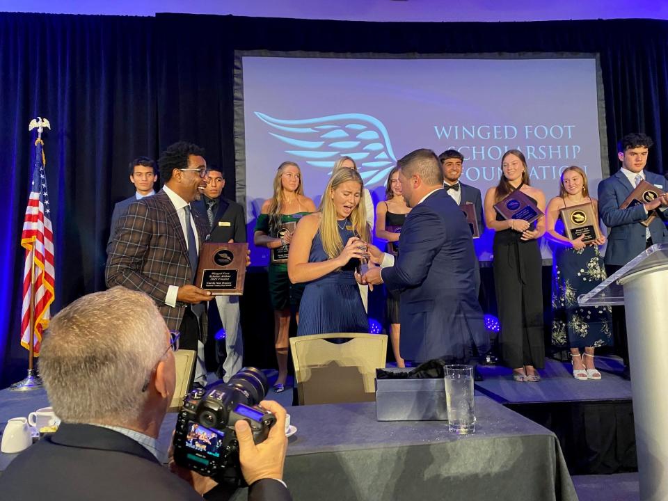 The Winged Foot Scholarship Foundation held its 34th annual banquet on May 15 at the Naples Grande Beach Resort. Seacrest Country Day's Carole Ann Hussey was named the 2023 Winged Foot Scholar Athlete. She was presented her award by Pro Football Hall of Famer Cris Carter and foundation chairman Buddy Hornbeck.