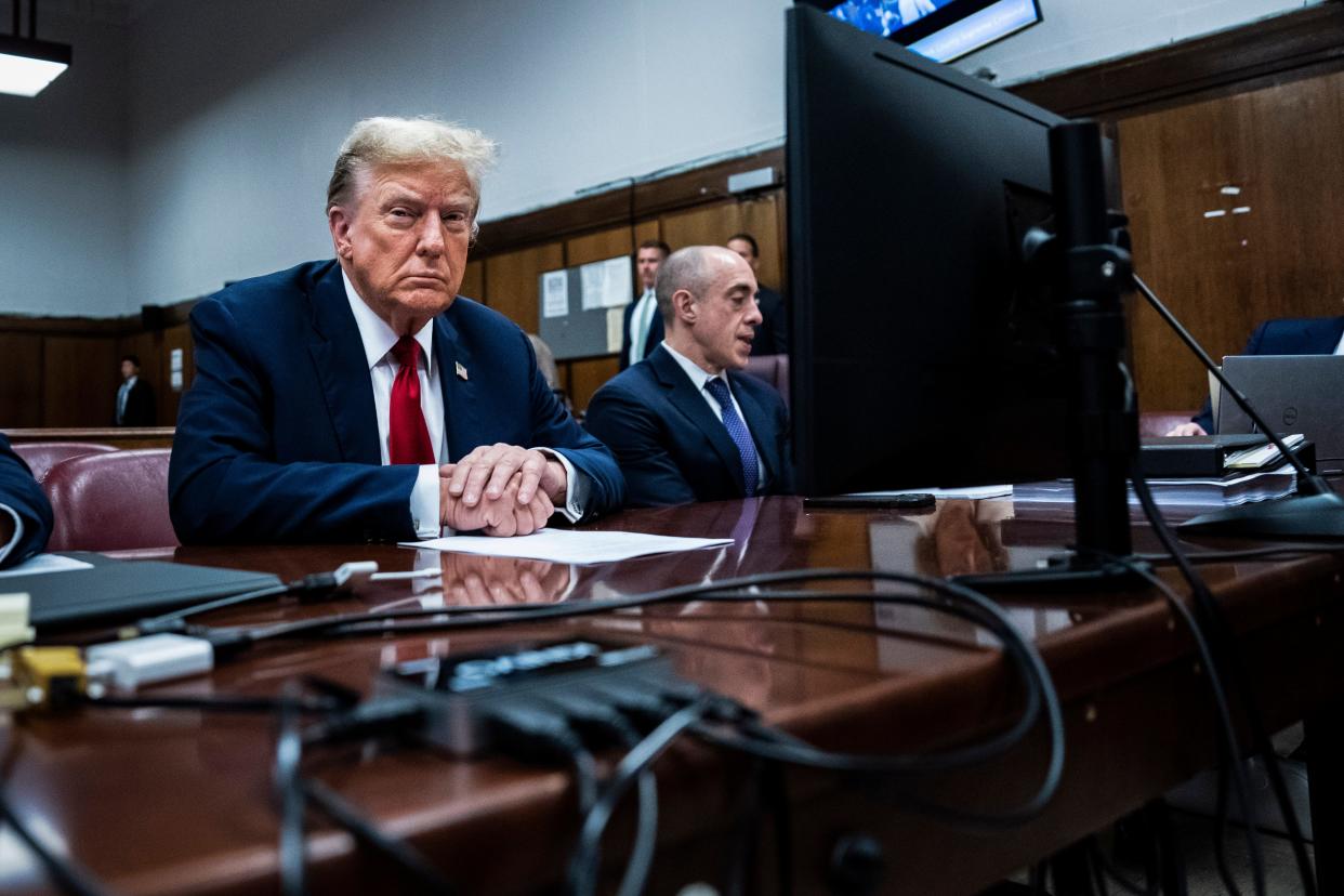 Former President Donald Trump sits in the courtroom during the first day of his trial for allegedly covering up hush money payments linked to extramarital affairs, at Manhattan Criminal Court in New York City on April 15, 2024.