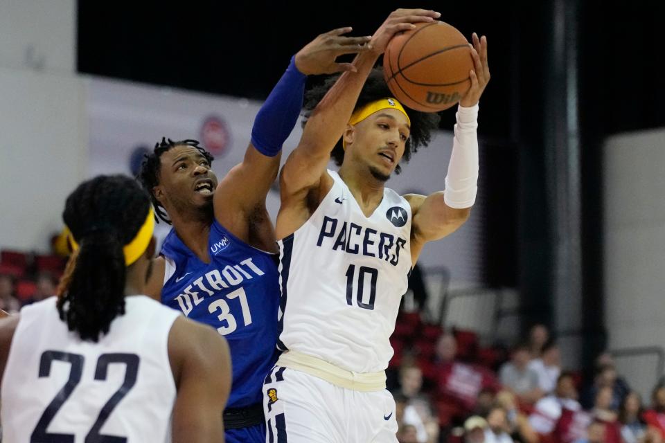 Pacers forward Kendall Brown grabs a rebound over Pistons forward Stanley Umude during the first half of the Pistons' 101-87 Summer League game on Tuesday, July 12, 2022, in Las Vegas.