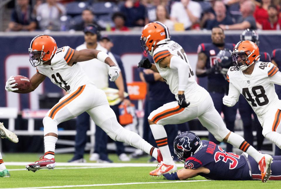 Dec 4, 2022; Houston, Texas, USA;  Cleveland Browns special teams player Donovan Peoples-Jones (11) breaks the tackle of Houston Texans linebacker Garret Wallow (32) and returns a punt for a touchdown in the second quarter at NRG Stadium. Mandatory Credit: Thomas Shea-USA TODAY Sports