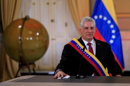 FILE PHOTO: Cuba's President Miguel Diaz-Canel attends a meeting with Venezuela's President Nicolas Maduro  in Caracas, Venezuela, May 30, 2018. REUTERS/Marco Bello/File Photo