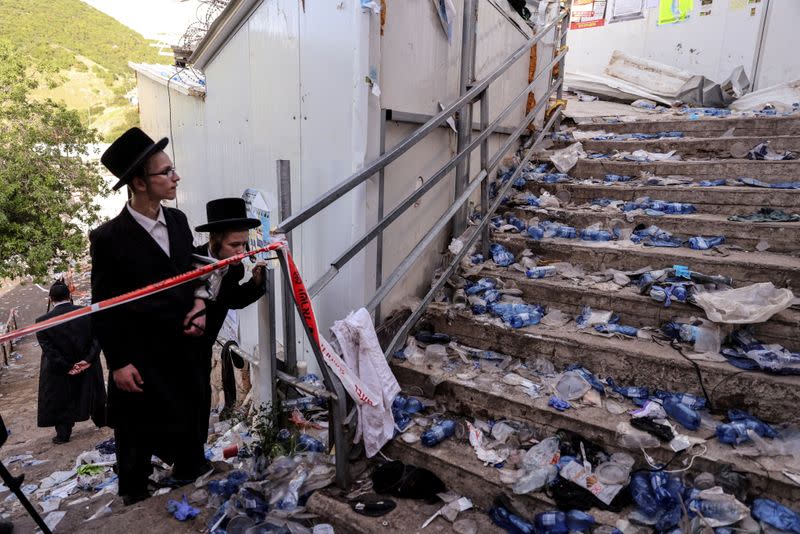 FILE PHOTO: Ultra Orthodox Jews look at stairs with waste on it in Mount Meron