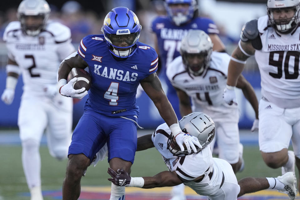 Kansas running back Devin Neal runs for a touchdown during the first half of an NCAA college football game against Missouri State Friday, Sept. 1, 2023, in Lawrence, Kan. (AP Photo/Charlie Riedel)