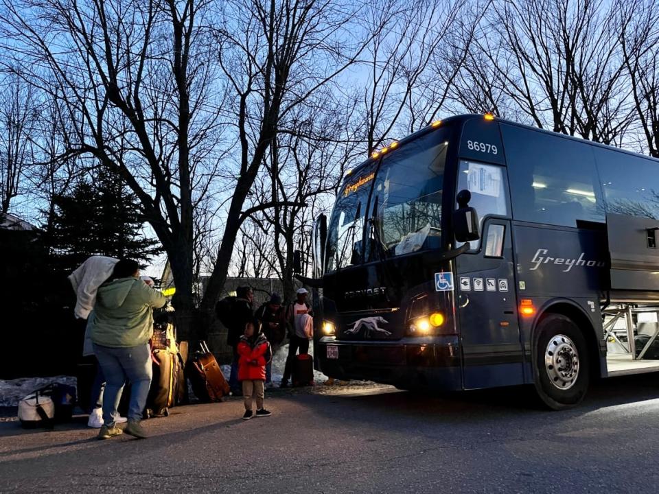 A group of migrants who were sent back to the United States after spending three days in custody on the Canada-U.S. border took a bus from Plattsburgh, N.Y., to New York City Tuesday night.  (Verity Stevenson/CBC - image credit)