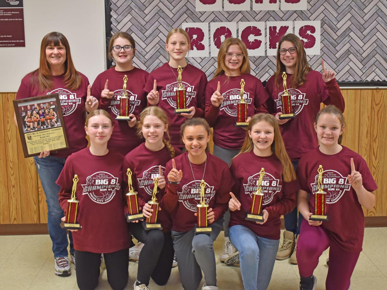 The Union City 7th grade girls basketball team celebrated their 10-0 season on Tuesday, the first middle school girls basketball team to go undefeated in school history. Pictured are, front row from left, Emme Eyre, Ellyse Flynn, Nala Payne, Alaina Fry, and manager Brooke Thomas; back row, from left, head coach Tina Scheidler, Aubrey Tennyson, Sydney Farnham, Jazelle Nagel and Emily Sander.