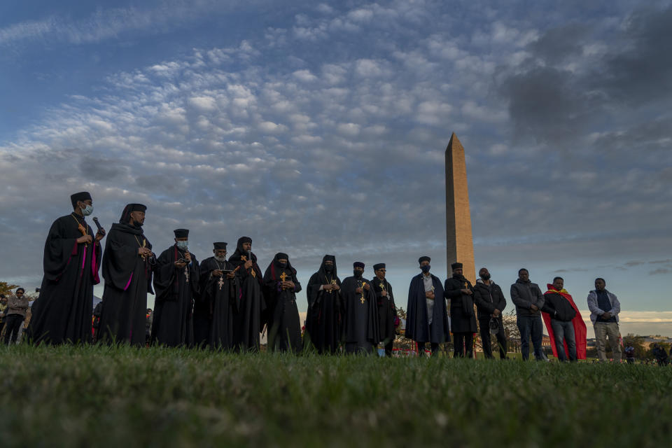 Faith leaders gather to conduct an event in Washington on Thursday, Nov. 4, 2021, to commemorate Tigray people killed in Ethiopia Prime Minister Abiy Ahmed's administration's attacks in Tigray, the northernmost region in Ethiopia. (AP Photo/Gemunu Amarasinghe)