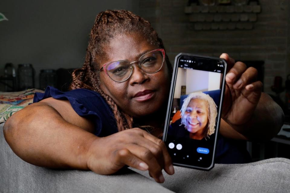 Janet Jarrett shows a photo of her sister, Pamela Jarrett, in Spring, Texas. Pamela Jarrett died after suffering heat-related distress due to the power outage caused by Hurricane Beryl (AP)