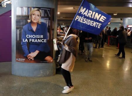 A supporter for Marine Le Pen, French National Front (FN) political party leader and candidate for French 2017 presidential election, attends a campaign rally in Nice, France, April 27, 2017. REUTERS/Eric Gaillard/Files