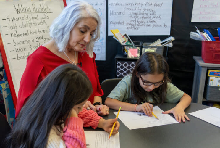 Missy Testerman works with a small group of ESL students in her Rogersville, Tenn., classroom. “I still find a lot of joy in teaching, and I feel like I’m as energized to keep teaching as I was years ago,” she said. (Tennessee Department of Education)