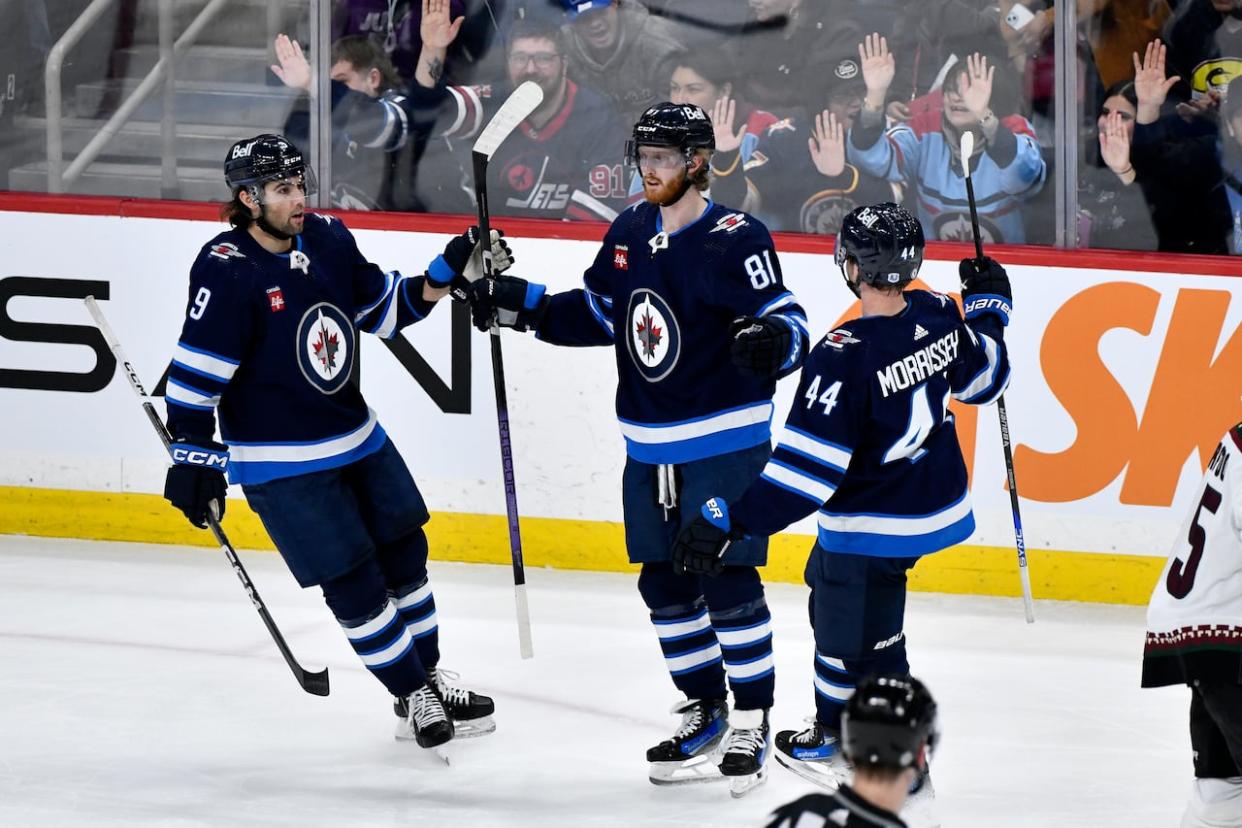 Winnipeg Jets wing Kyle Connor celebrates his winning goal against the Arizona Coyotes on Sunday. The Jets are having one of the strongest seasons ever this year, on the ice. Average attendance, however, is the lowest for Winnipeg since the NHL returned to the city, not counting seasons in which pandemic restrictions were in place. (Fred Greenslade/The Canadian Press - image credit)