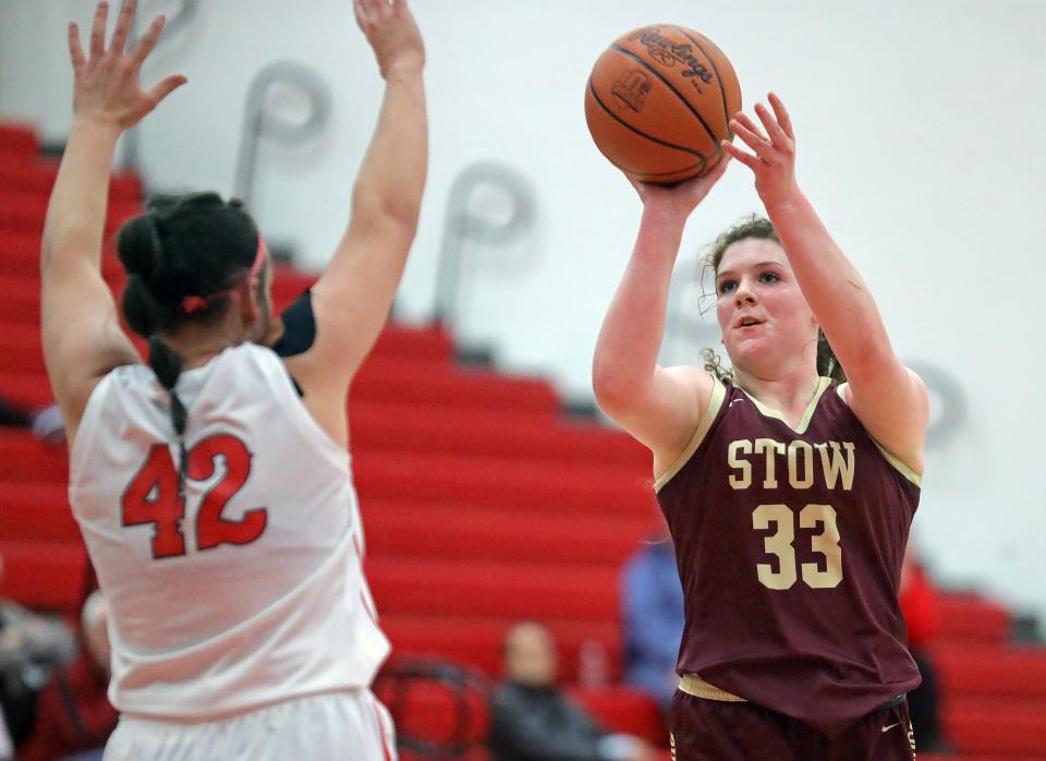 Stow's Kennady Dodds, right, attempts a shot over Wadsworth's Lyla Wilson on Dec. 13, 2023, in Wadsworth.