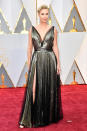 <p>Charlize Theron consistently delivers an amazing look on just about any red carpet she steps out on. Wearing a metallic Dior gown with a thigh-high slit and low-cut neckline, she did so yet again. <em>(Photo: Getty Images)</em> </p>