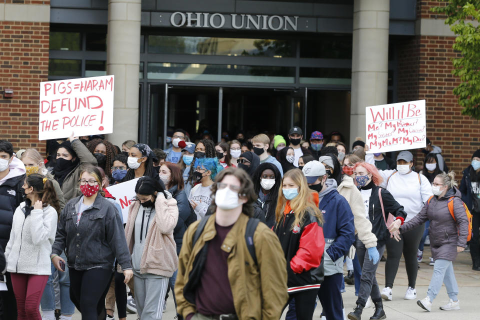 Students leave the Ohio Union on the campus of Ohio State University to protest the shooting of Ma'Khia Bryant a day earlier by Columbus Police, Wednesday, April 21, 2021, in Columbus, Ohio. (AP Photo/Jay LaPrete)