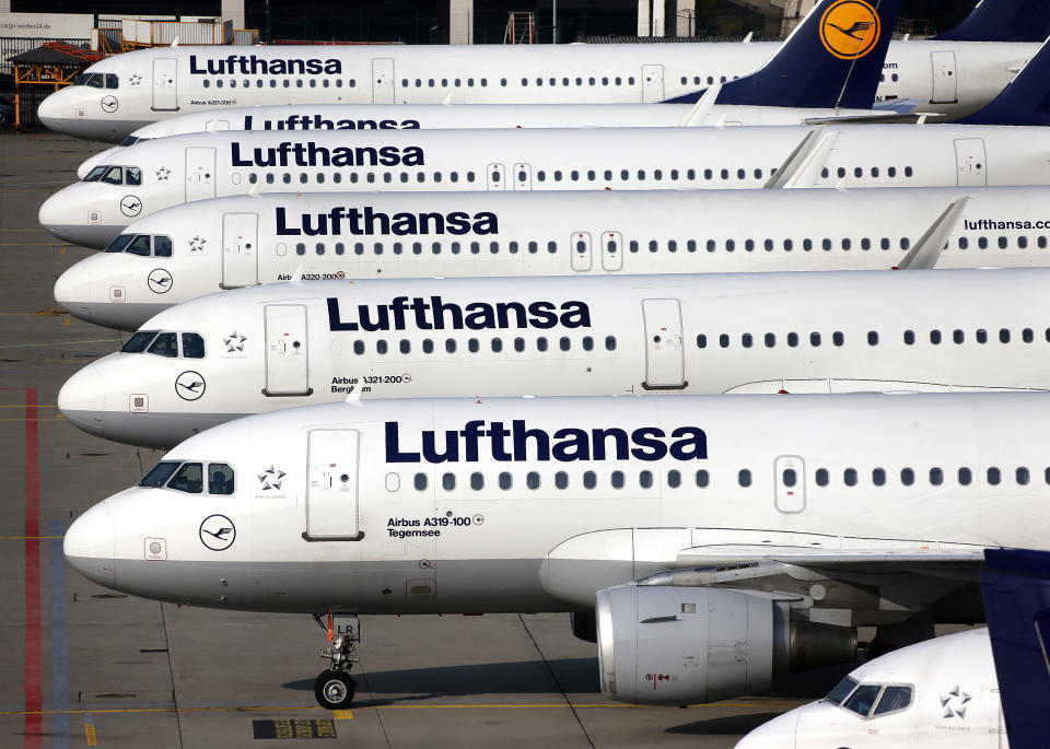 Lufthansa aircrafts are parked as Lufthansa pilots went on a three-days-strike in Frankfurt, Germany, Wednesday, April 2, 2014. Germany's Lufthansa said it has canceled almost 900 domestic and intercontinental flights on the first day of a three-day strike by the pilots' union. Airline spokeswoman Barbara Schaedler said that up to 900 flights were canceled for Wednesday and that it expects to cancel about 3,800 flights altogether, affecting more than 425,000 passengers. (AP Photo/Michael Probst)