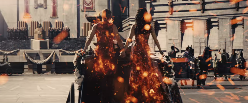 Though Katniss igniting their costumes while staring dead into Snow's eyes is its own *chef's kiss* moment. 