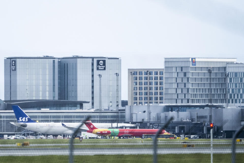 DAT aircraft with evacuees from Afghanistan arrives at Copenhagen Airport in Kastrup, Denmark Wednesday, Aug. 18, 2021. The aircraft with 14 evacuated Norwegians and a person legally resident in Denmark has flown from Islamabad in Pakistan via Tbilisi in Georgia. The red DAT plane was used to fly the Danish national football team around during the European Championships. (Martin Sylvest /Ritzau Scanpix)