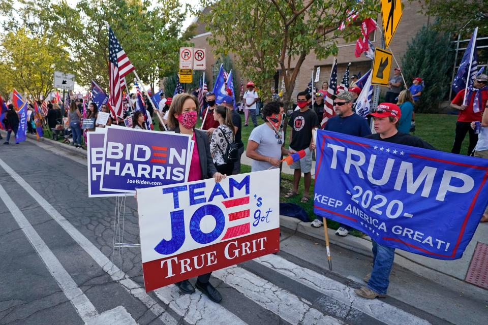 People proclaim their support near the site of the vice presidential debate Oct. 7 in Salt Lake City.