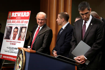 U.S. Attorney General Jeff Sessions (L) arrives at a news conference with other law enforcement officials to announce enforcement efforts against Cartel Jalisco Nueva Generacion (CJNG) at the Justice Department in Washington, U.S., October 16, 2018. REUTERS/Yuri Gripas