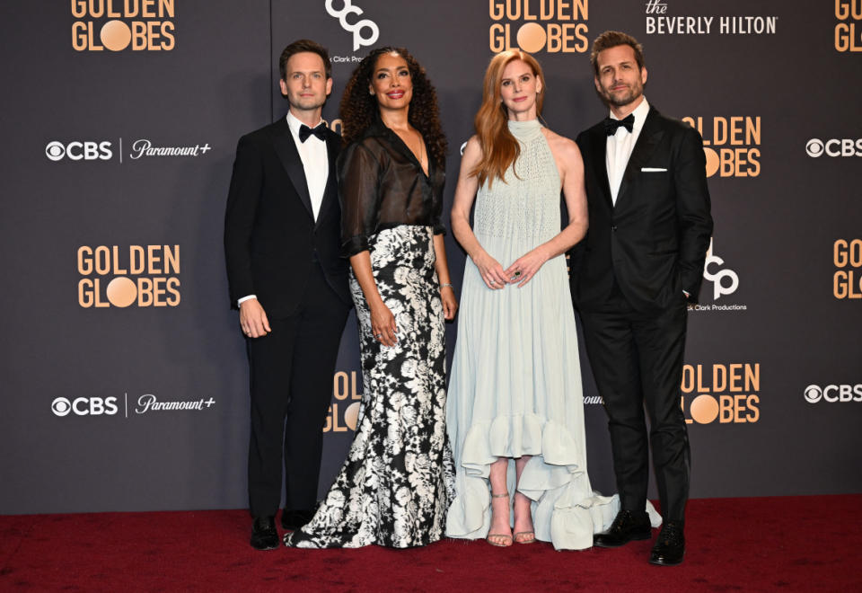 (L-R) Actors Patrick J. Adams, Gina Torres, Sarah Rafferty and Gabriel Macht pose in the press room during the 81st annual Golden Globe Awards at The Beverly Hilton hotel in Beverly Hills, California, on January 7, 2024. (Photo by Robyn BECK / AFP) (Photo by ROBYN BECK/AFP via Getty Images)<p>ROBYN BECK/Getty Images</p>