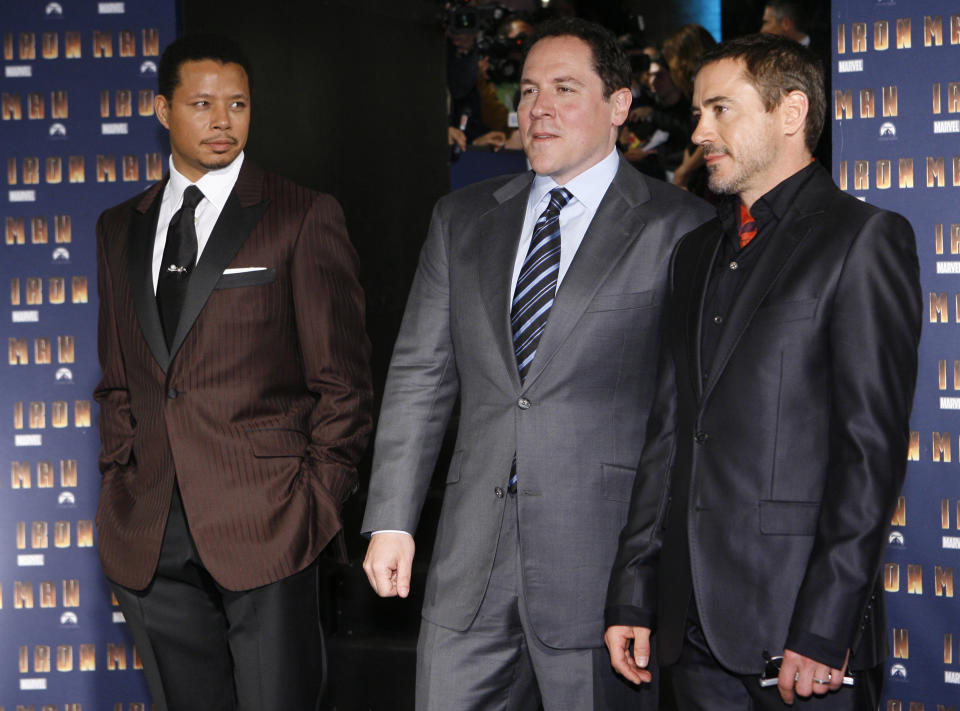 U.S. actor Terrence Howard, director Jon Favreau and actor Robert Downey Jr. pose for photographers as they arrive for the screening of the movie "Iron Man", in Rome, Wednesday, April 23, 2008.(AP Photo/Alessandra Tarantino)