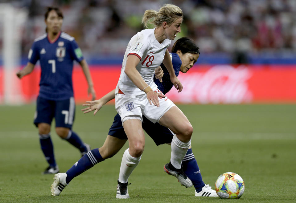 England's Ellen White, front, and Japan's Rikako Kobayashi, right, challenge for the ball during the Women's World Cup Group D soccer match between Japan and England at the Stade de Nice in Nice, France, Wednesday, June 19, 2019. (AP Photo/Claude Paris)