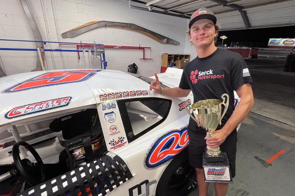 Carter Langley is all smiles after having placed the newest winner‘s decal on his car following his win in the second race of the two 70-lap Sentara Health Late Model Stock Car Division races that highlighted Billy‘s A/C Service Night Race at South Boston Speedway on July 15, 2023. Langley was awarded the win after apparent winner Landon Huffman‘s car failed to pass the post-event technical inspection by track NASCAR officials. (Joe Chandler/South Boston Speedway)