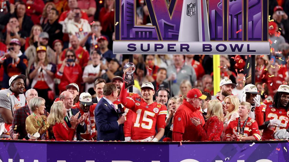 Kansas City Chiefs quarterback Patrick Mahomes lifts the Super Bowl trophy