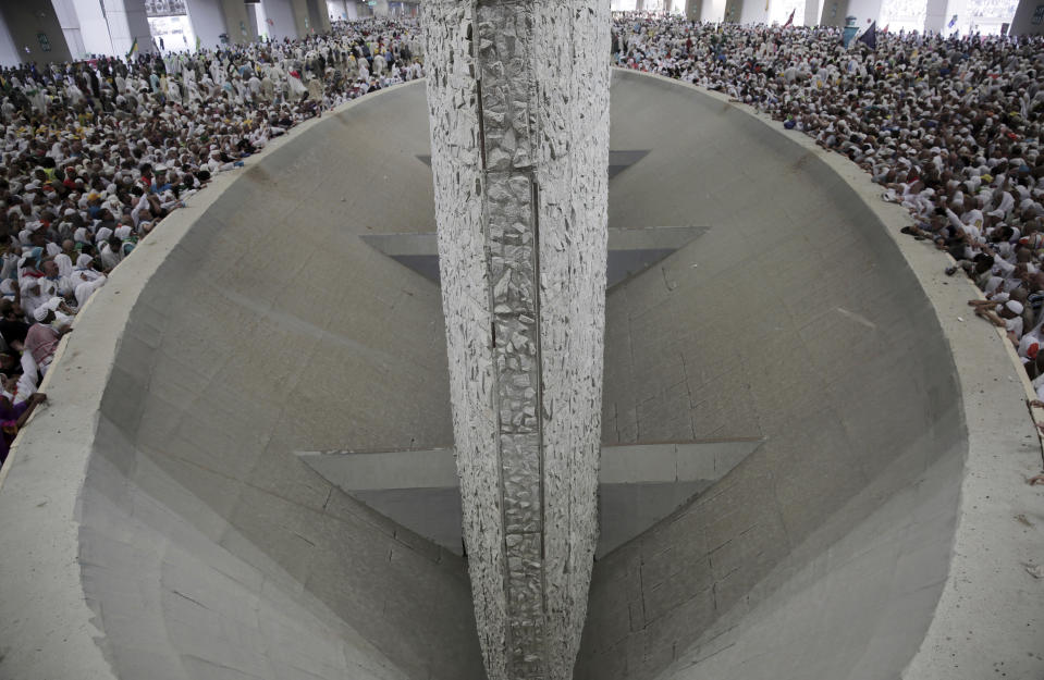 <p>Muslim pilgrims cast stones at three huge stone pillars in the symbolic stoning of the devil, outside the holy city of Mecca, Saudi Arabia, Saturday, Sept. 2, 2017. (Photo: Khalil Hamra/AP) </p>