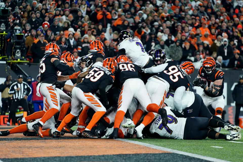 The Bengals force a fumble as Ravens quarterback Tyler Huntley reaches toward the end zone.