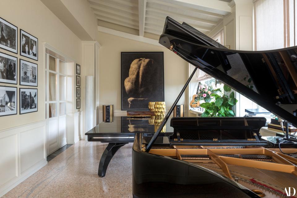 One of the family’s favorite spaces is this sunlit room, which is anchored by the Giovane Accovacciato photo by Aurelio Amendola (produced by Giannoni & Santoni).