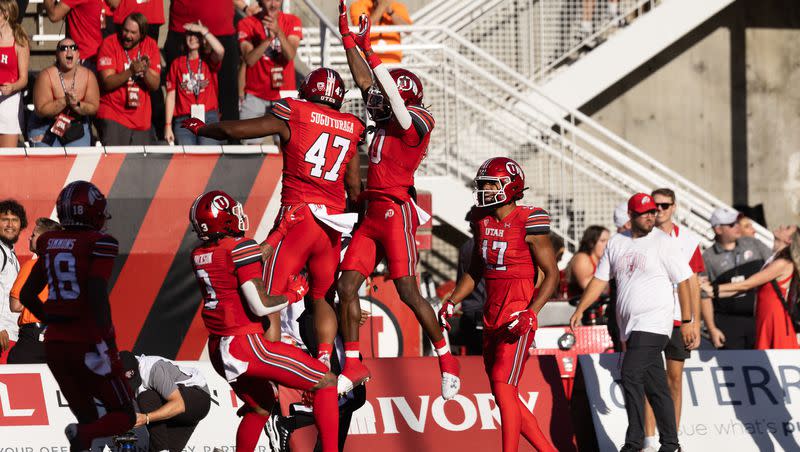 Utah Utes football players celebrate Utes’ Money Parks’ (10) touchdown during the first quarter of their season opener against Florida at Rice-Eccles Stadium in Salt Lake City on Thursday, Aug. 31, 2023.