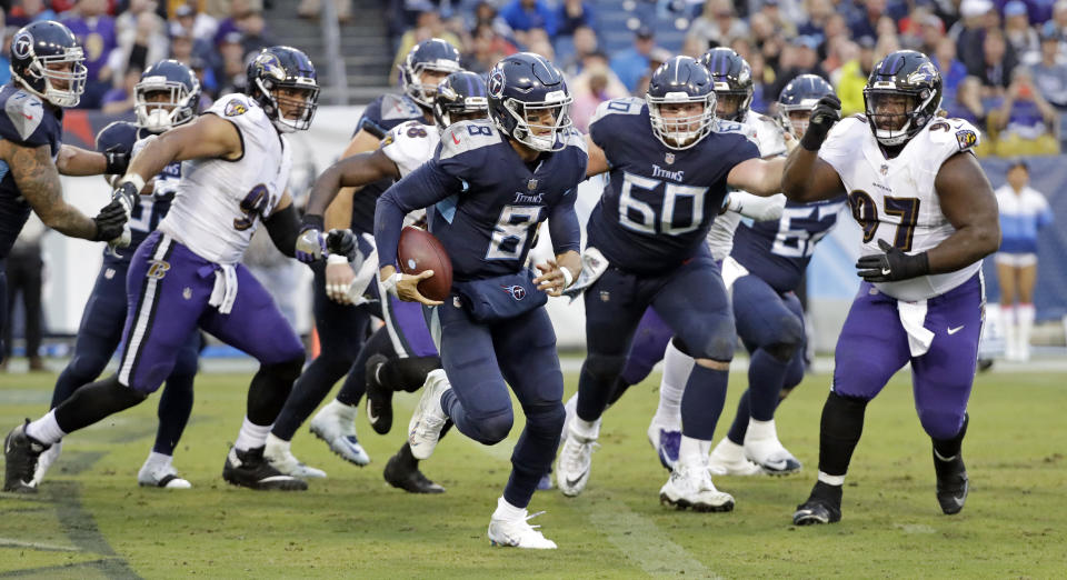 Tennessee Titans quarterback Marcus Mariota (8) scrambles against the Baltimore Ravens in the second half of an NFL football game Sunday, Oct. 14, 2018, in Nashville, Tenn. (AP Photo/James Kenney)