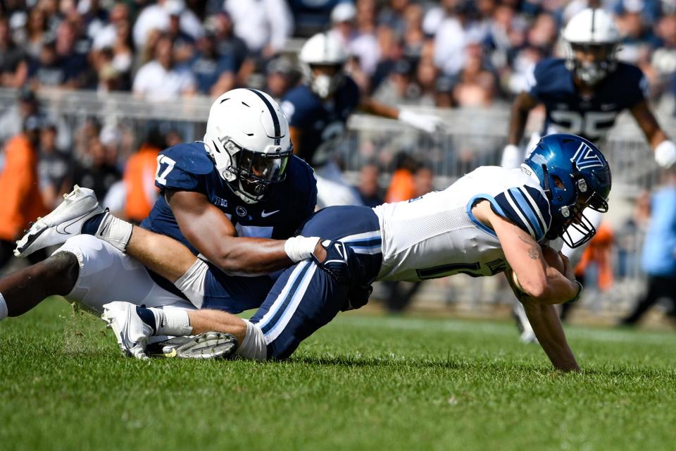 Penn State defensive end Arnold Ebiketie (17) sacks Villanova quarterback Daniel Smith, right, during an NCAA college football game in State College, Pa., on Saturday, Sept. 25, 2021. (AP Photo/Barry Reeger)