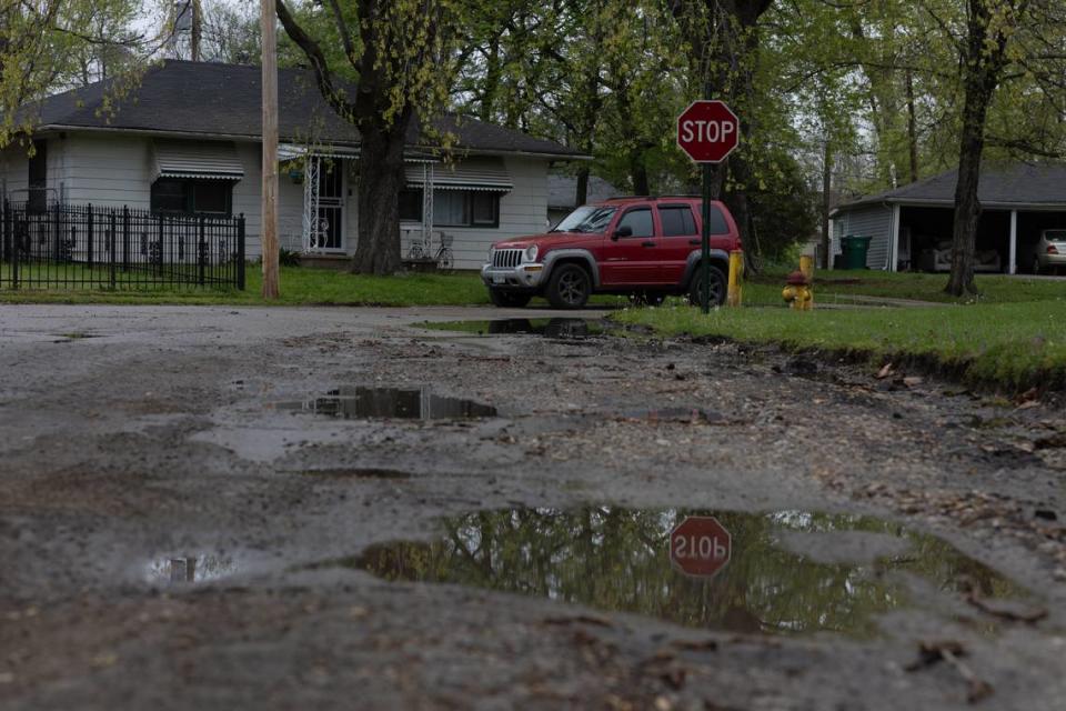 Rain pools on the ground in the Piat Place neighborhood of Cahokia Heights after a light rain on April 10, 2024.