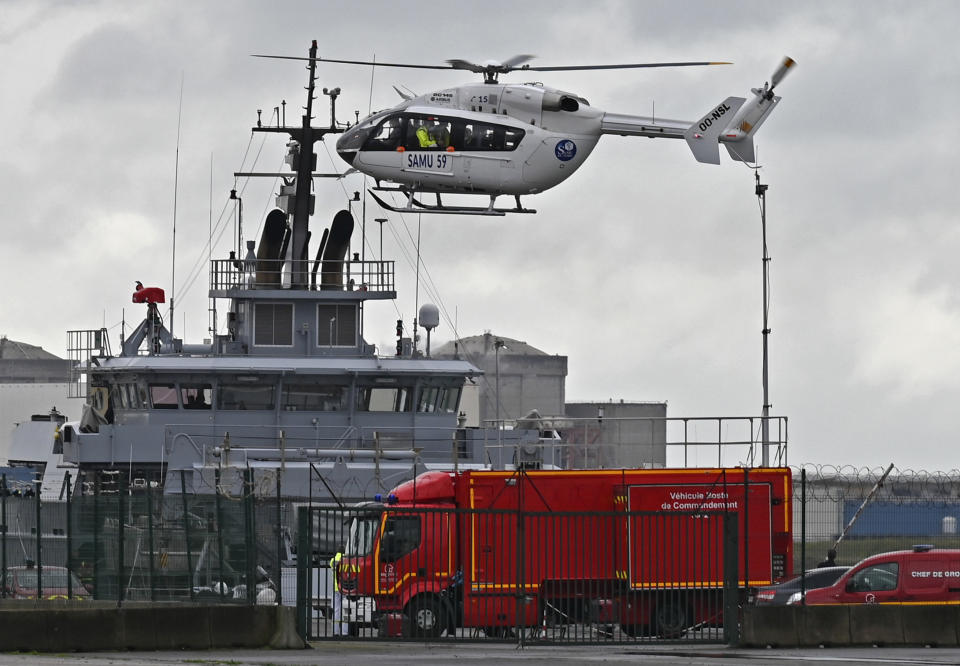 A French rescue helicopter lands close to a rescue vessel in Dunkirk, northern France, Tuesday, Oct. 27, 2020 during a search operation after four migrants, including a 5-year-old and 8-year-old child died Tuesday when their boat capsized while they and other migrants tried to cross the English Channel to Britain, French authorities said. Fifteen migrants have been saved so far and rescue and search operations are still under way, according to the regional administration for the Nord region. (AP Photo)