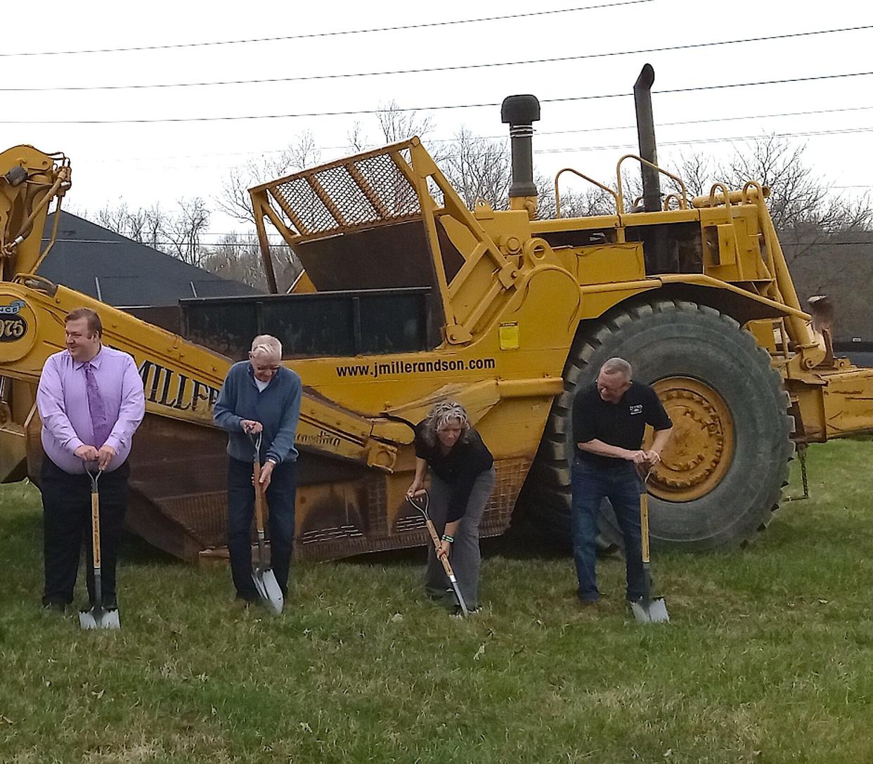 Health Commissioner Michael Derr (from left),  Arlie Rodhe, Misty Burns and Kent Rodhe break ground at the site of the new Holmes County General Health District building on Glen Drive in Millersburg.