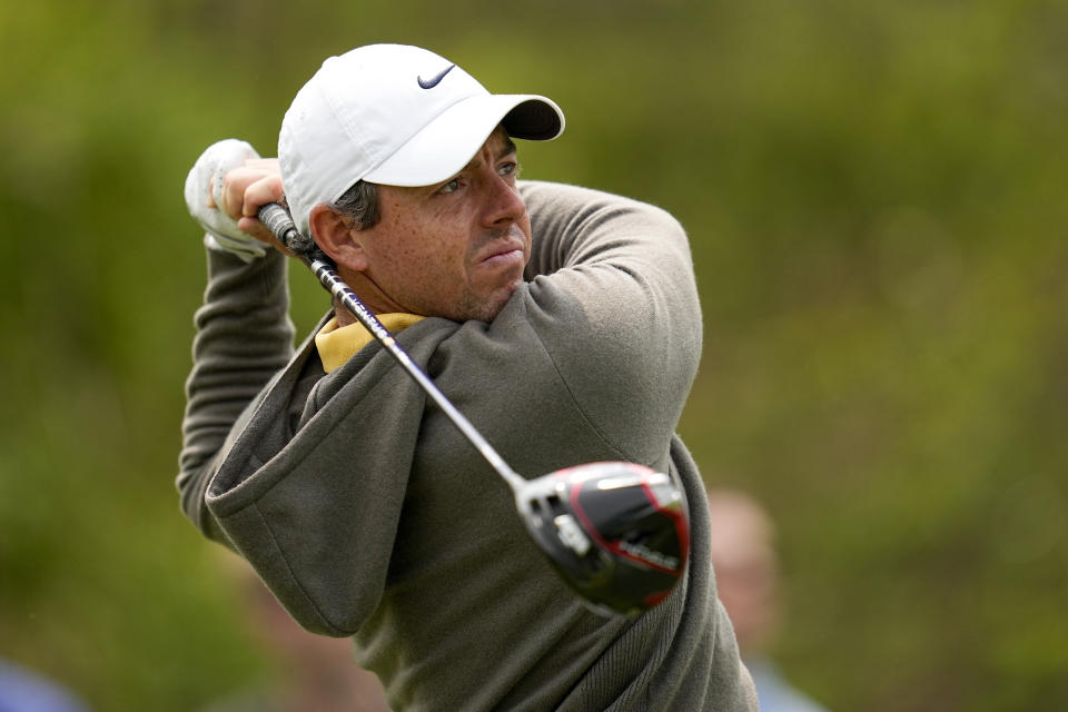 Rory McIlroy, of Northern Ireland, watches his tee shot on the 17th hole during a practice around for the PGA Championship golf tournament at Oak Hill Country Club on Tuesday, May 16, 2023, in Rochester, N.Y. (AP Photo/Abbie Parr)